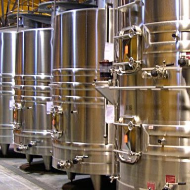 Large silver tanks used to make bubbles in the charmat style